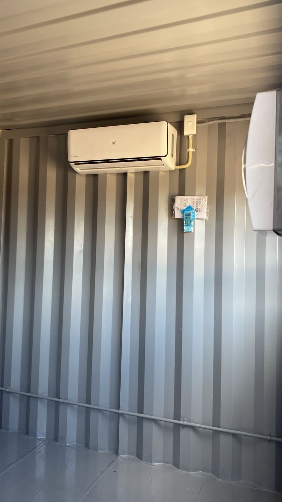 Insulated container office cabin conversion featuring air conditioning unit