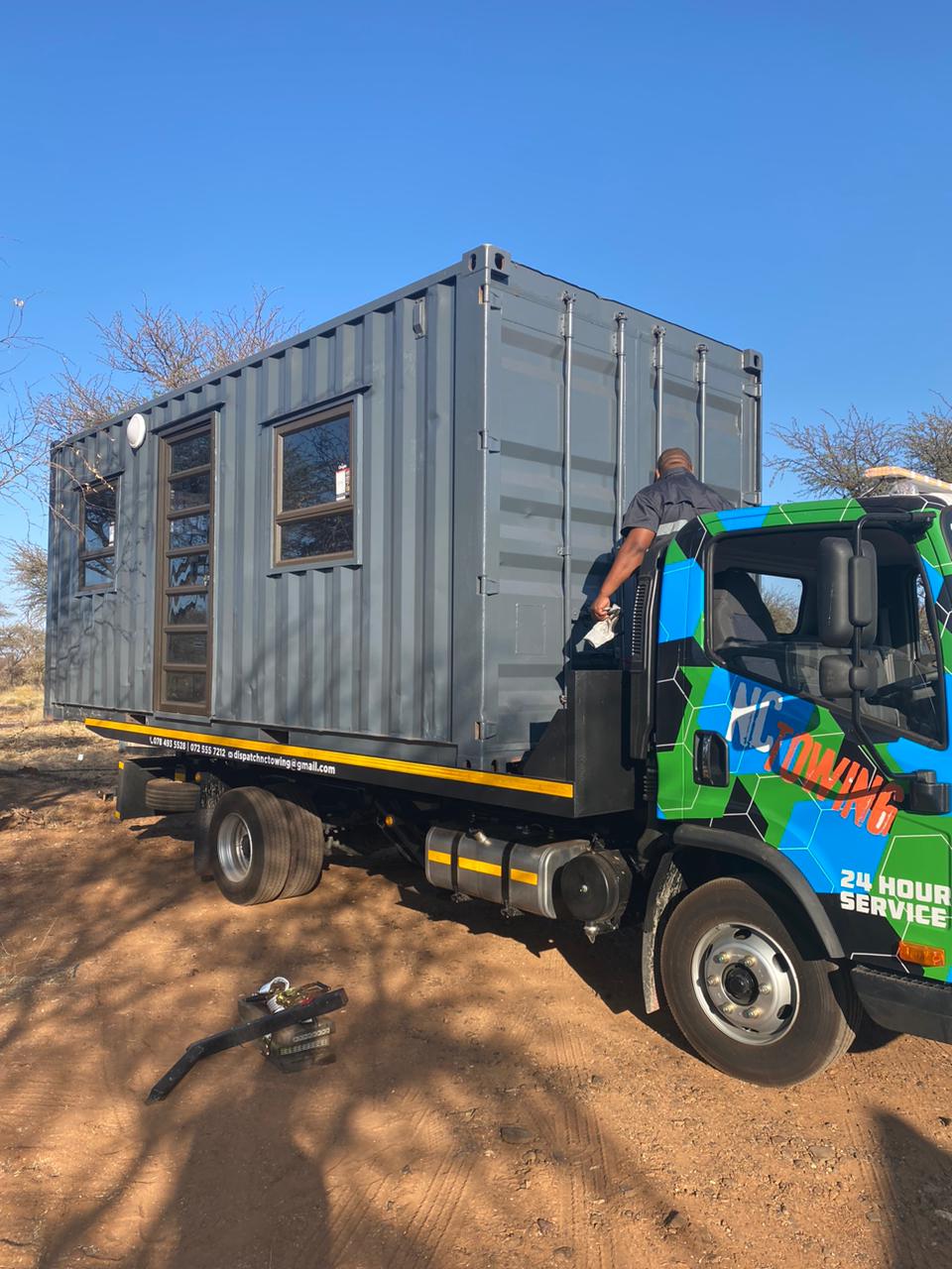Secure transport and delivery tracking of a site cabin container conversion